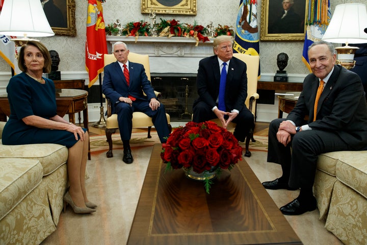 Nancy Pelosi (D-Calif.), Vice President Mike Pence, President Donald Trump and Chuck Schumer (D-N.Y.) wait as media leave a meeting in the Oval Office on Dec. 11.