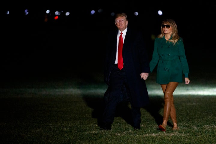 Donald and Melania Trump arrive on the South Lawn of the White House on Thursday after making a surprise visit to troops in Iraq.