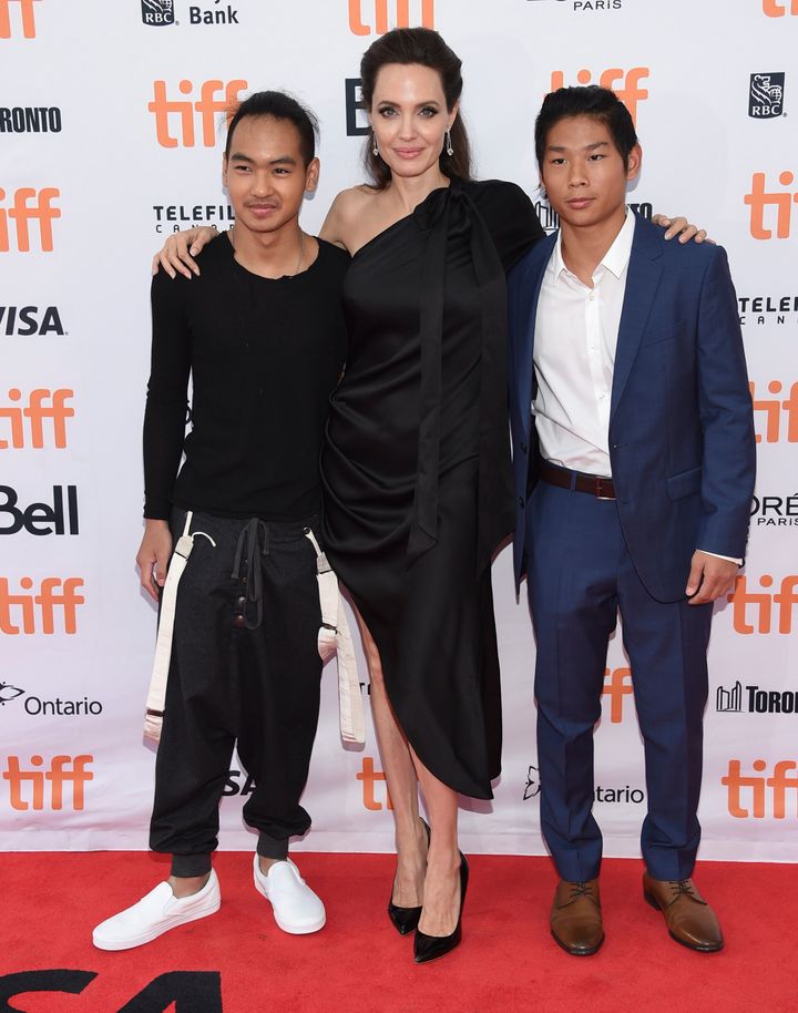 Maddox Jolie-Pitt, Angelina Jolie and Pax Jolie-Pitt attend a premiere for