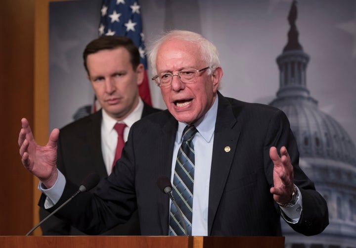 Sen. Bernie Sanders (I-Vt.), joined at left by Sen. Chris Murphy (D-Conn.), holds a news conference after the Senate passed a resolution pulling aid from the Saudi-led war in Yemen.