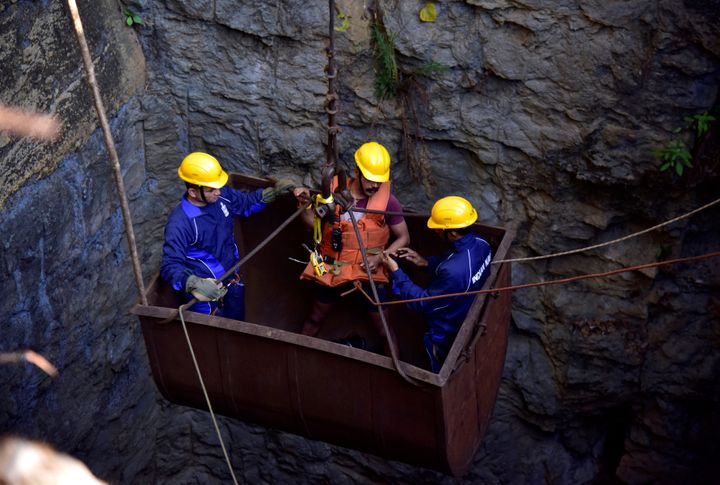 Divers use a pulley to enter a coal mine that collapsed in Ksan, in Meghalaya,, December 29, 2018.