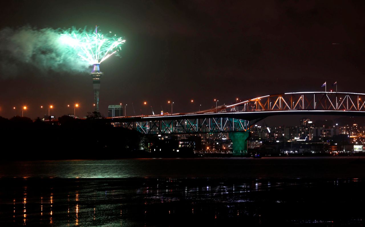 Pyrotechnics erupt from Auckland's Sky Tower as thousands of revellers welcome 2019.