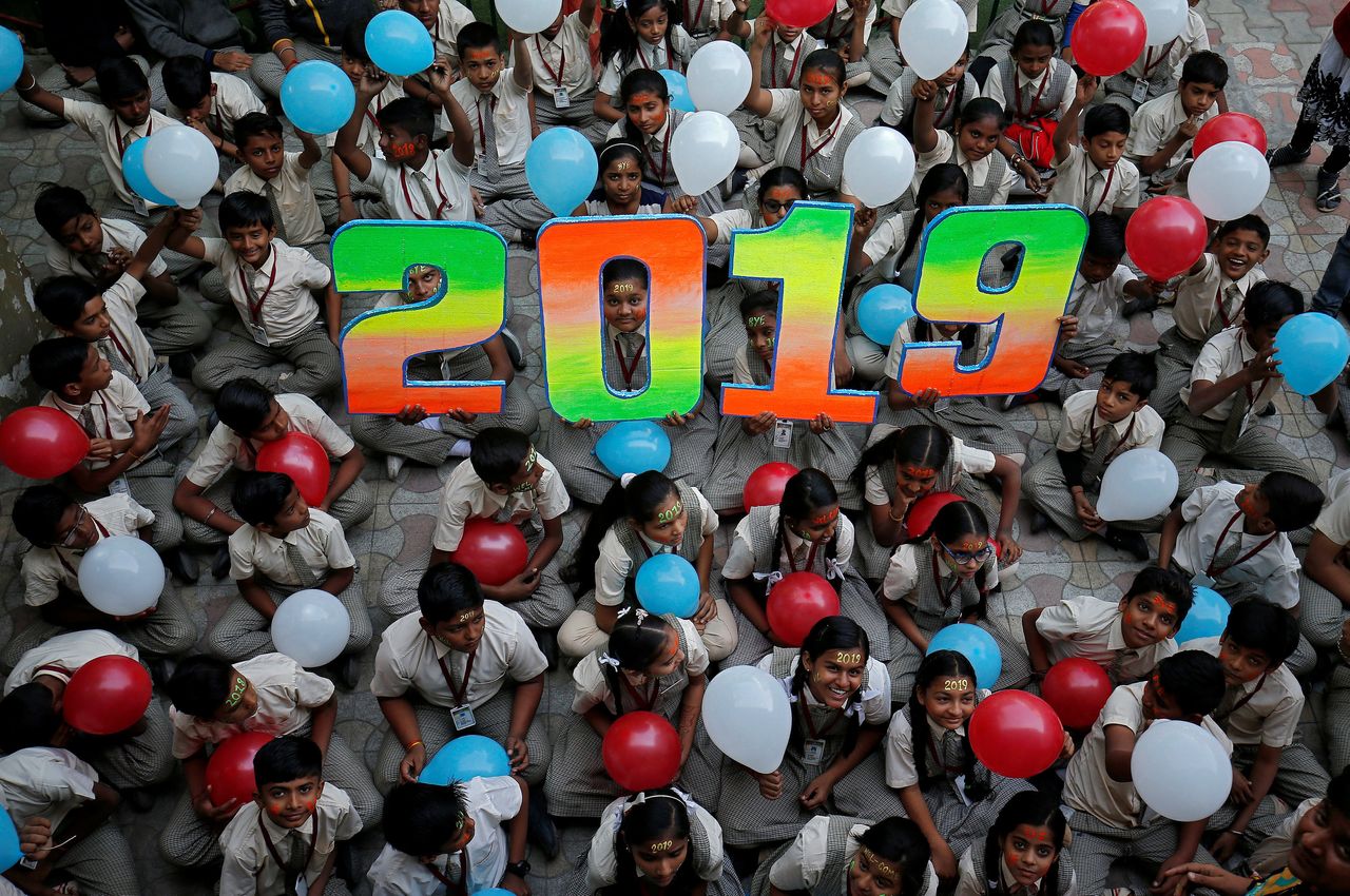 Schoolchildren in Ahmedabad, India, pose as part of celebrations to welcome the new year.