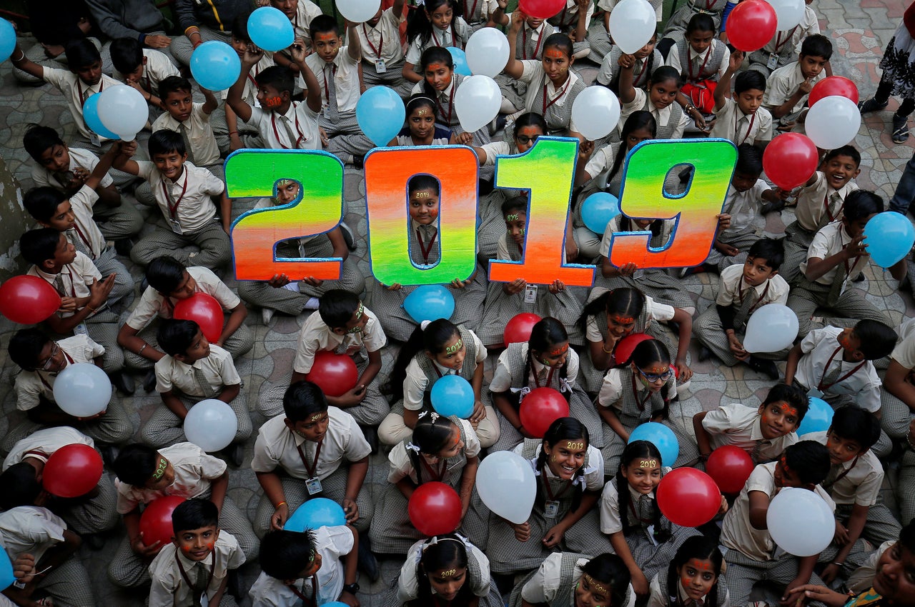 Schoolchildren in Ahmedabad, India, pose as part of celebrations to welcome the new year.