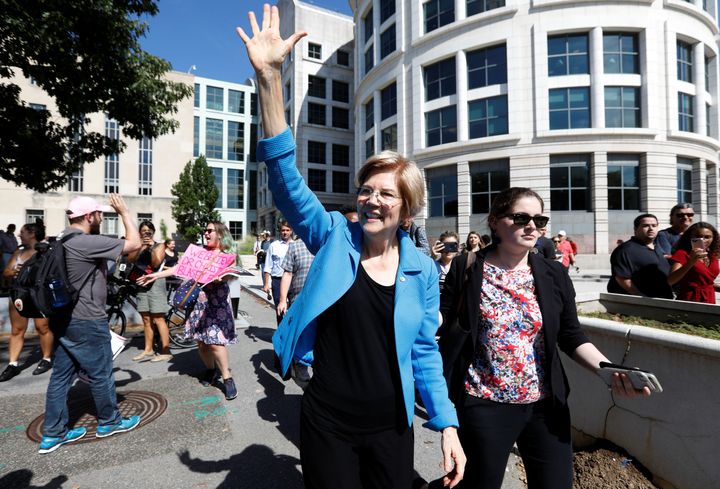 Elizabeth Warren waves as activists gather for a protest march and rally in opposition to US Supreme Court nominee Brett Kavanaugh in October.