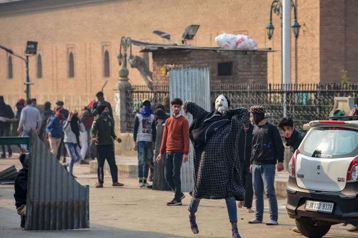 Kashmiri protesters seen on the streets during clashes in Srinagar 21 December 2018.