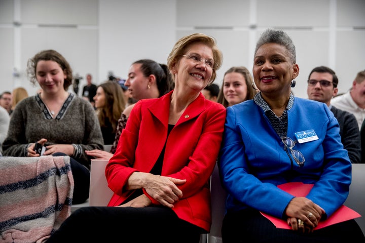 Sen. Elizabeth Warren (D-Mass.) speaks with American University senior associate dean Brenda Smith, right, after speaking at the Washington College of Law on Nov. 29.