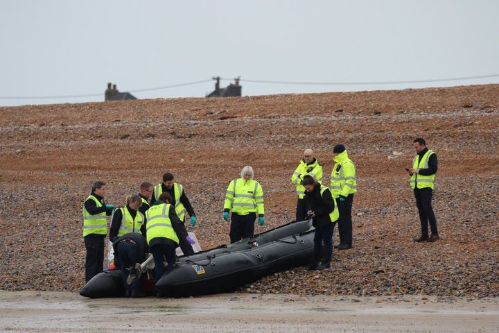The UK's Border Force carries an intercepted migrant dinghy off the Kent coast.