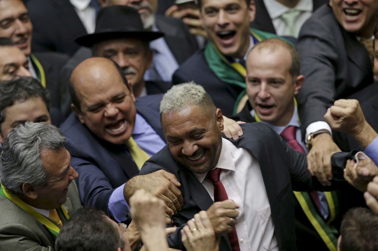 Tiririca, a Brazilian comedian and member of the Lower House of Congress, is congratulated after voting in favor of the impeachment of President Dilma Rousseff in Brasilia, on April 17, 2016. 