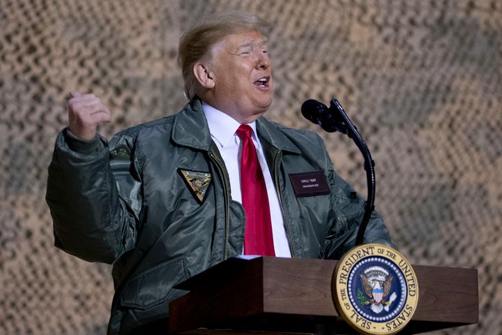 President Donald Trump speaks at a hangar rally at Al Asad Air Base, Iraq, on Dec. 26, 2018, where he defended his decision to withdraw U.S. forces from Syria.