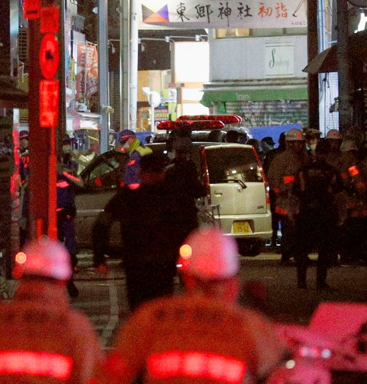 A car is inspected by police following a car attack on Takeshita Street in Tokyo, early Tuesday morning.