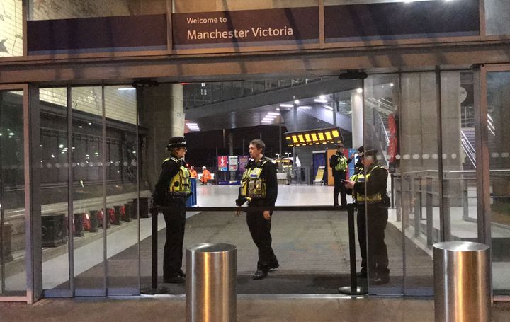 Police at Victoria Station in Manchester last night.