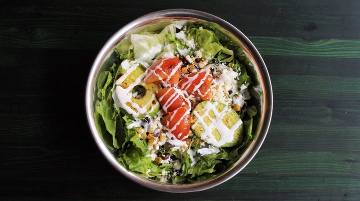 The grilled avocado salad at Snappy Salads is made with red leaf and iceberg lettuce; black bean, poblano and corn relish; grilled avocado and thick-sliced tomato; queso fresco; chipotle-lime vinaigrette; and crema.