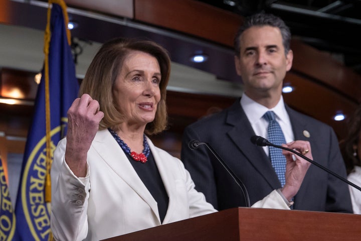 Speaker Nancy Pelosi (D-Calif.) and Rep. John Sarbanes (D-Md.) discuss the For the People Act at a news conference on Nov. 18.