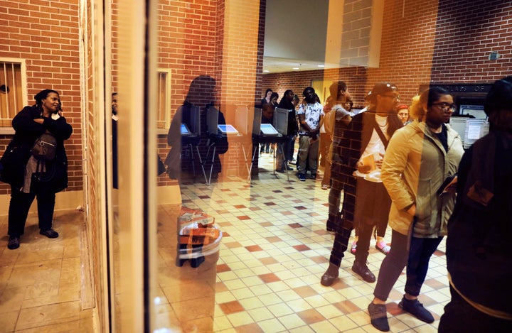 The reform bill aims to reduce voting problems, such as the long lines seen at polling locations on Election Day, like this one in Fulton County, Georgia, on Nov. 6.