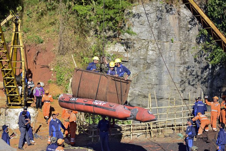 Navy personnel come out of a coal mine during a rescue operation in Ksan, Meghalaya.