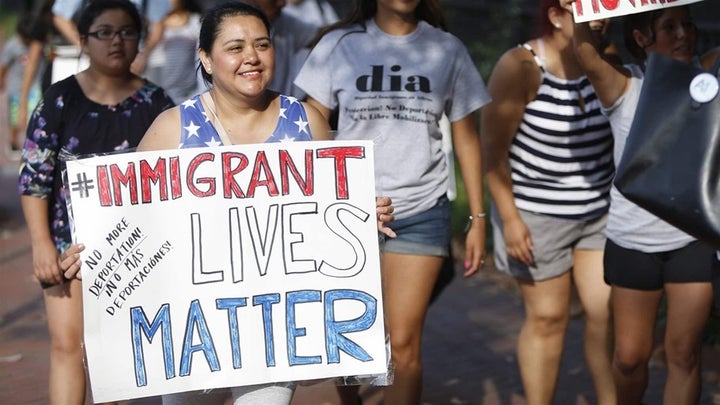 <p>Demonstrators march in Athens, Georgia, after undocumented immigrants there were arrested in July for driving without a license. A 2011 state law permits law enforcement officers to stop anyone they deem to be “suspicious” and ask for their papers. </p>