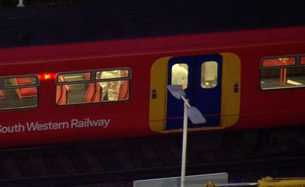 Forensic officers combed the train involved for clues on Friday night.