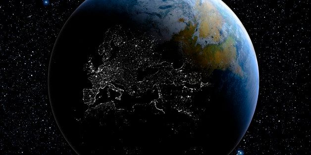 Earth from space showing day into night effect with city lights displaying on dark side