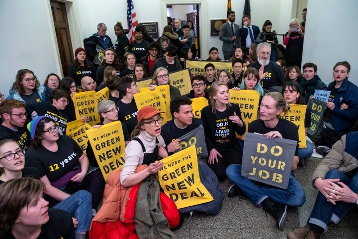 Protesters with the Sunrise Movement stage a sit-in in the office of Rep. Steny Hoyer, now the House majority leader, late la