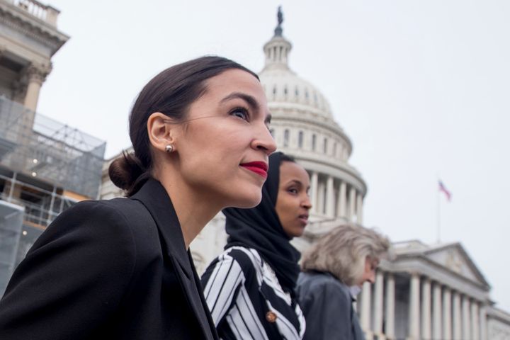 Democratic Reps. Alexandria Ocasio-Cortez (left) and Ilhan Omar (center) at the Capitol on Jan. 4. They and other women of color entering Congress are not cogs of a party machine.