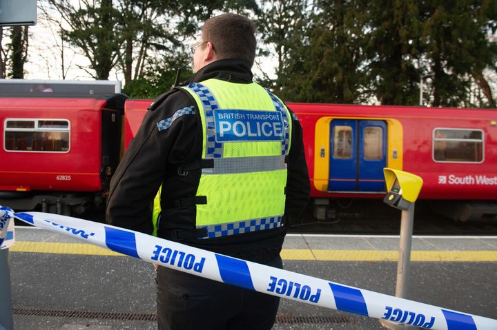 Police guard the South Western Trains service at Horsley station following Friday's incident.