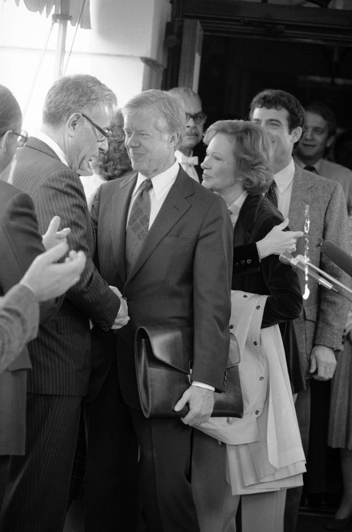 President Jimmy Carter shaking hands with Defense Secretary Harold Brown in 1980.