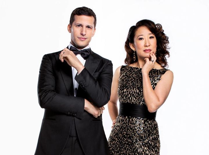 Andy Samberg and Sandra Oh strike a pose in their official Golden Globes portraits.