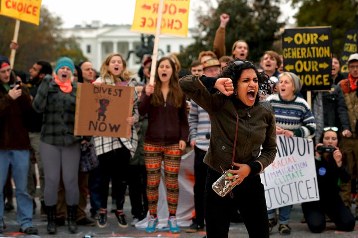 In a photo from three years ago, Varshini Prakash, then with the Divestment Student Network leads chants of "I believe that we will win" during a student climate protest in Washington.