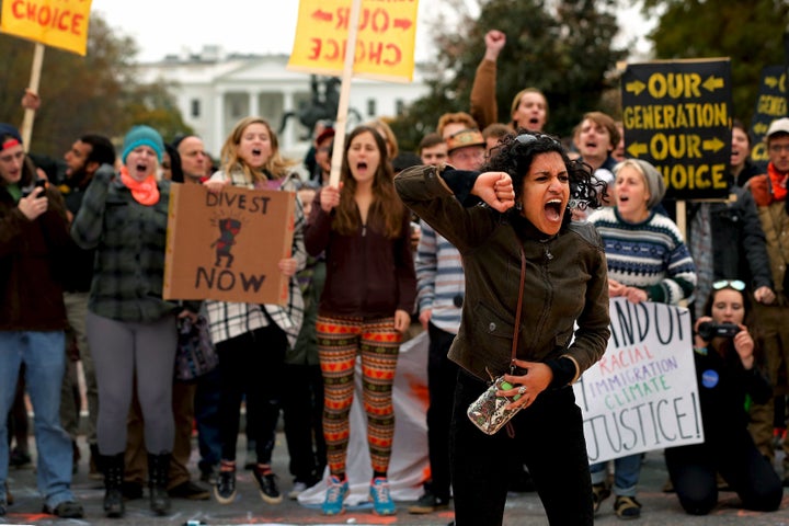 In a photo from three years ago, Varshini Prakash, then with the Divestment Student Network leads chants of "I believe that we will win" during a student climate protest in Washington. 