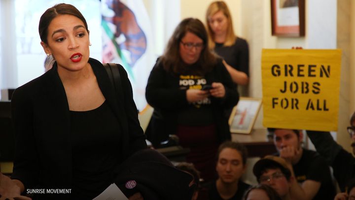Then-Rep.-elect Alexandria Ocasio-Cortez (D-N.Y.) speaking at the Sunrise Movement protest in then-Minority Leader Nancy Pelosi's office in November.