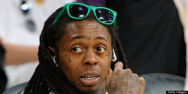 LOS ANGELES, CA - APRIL 28: Lil Wayne attends an NBA playoff game between the San Antonio Spurs and the Los Angeles Lakers at Staples Center on April 28, 2013 in Los Angeles, California. (Photo by Noel Vasquez/Getty Images)