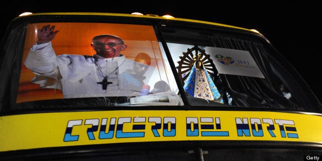 With a poster of Pope Francis and the Virgin of Lujan, the bus leading a convoy taking some 400 Argentine pilgrims to Rio de