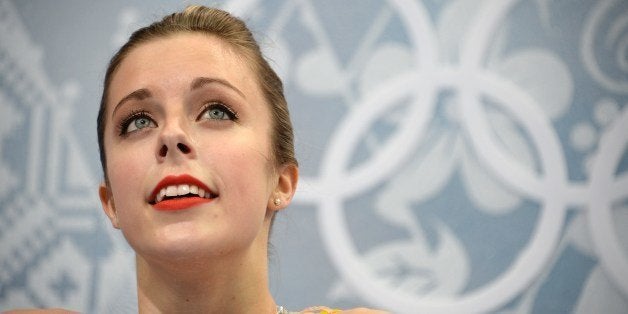 US Ashley Wagner reacts in the kiss and cry zone during the Women's Figure Skating Free Program at the Iceberg Skating Palace during the Sochi Winter Olympics on February 20, 2014. AFP PHOTO / DAMIEN MEYER (Photo credit should read DAMIEN MEYER/AFP/Getty Images)