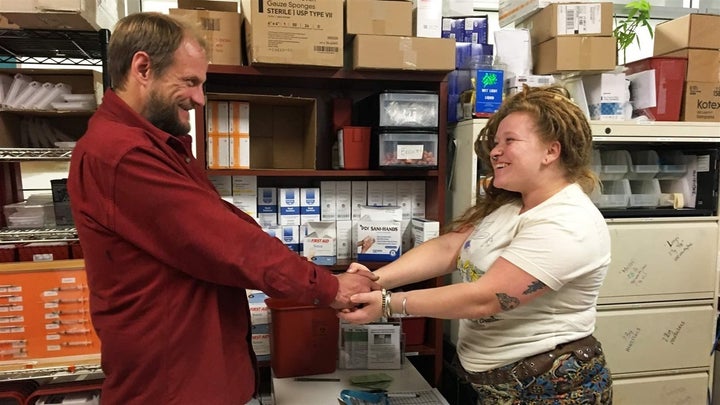 Amber Sheldon, right, greets a frequent client at the harm reduction program at Glide in San Francisco. The program offers clean syringes, drug test strips and other supplies to frequent drug users. Sheldon and others in the city’s harm reduction community help drug users learn how to protect themselves and others from fatal overdoses. 