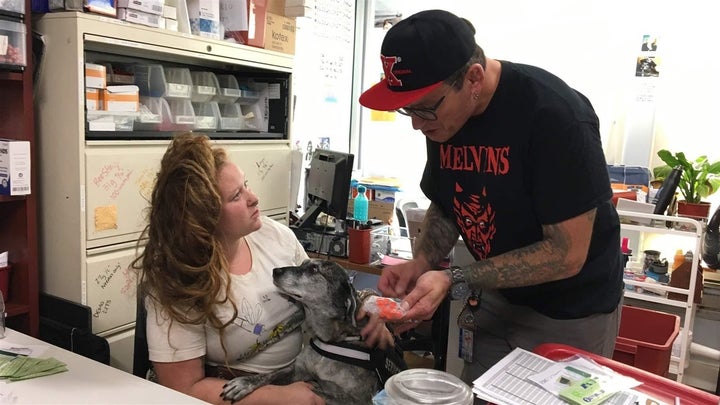 Harm reduction professionals Amber Sheldon, left, and William Buehlman at their office in San Francisco, with dog Daydream.