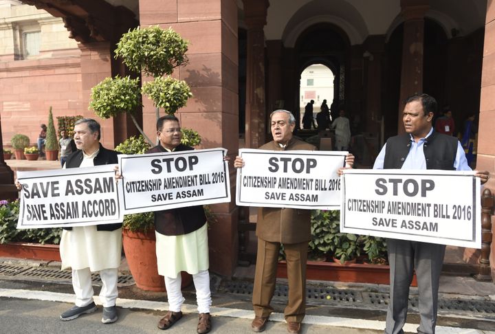 Congress MPs hold placards during a protest demanding to stop citizenship amendment bill 2016, during the Winter Session of Parliament, on January 7, 2019.