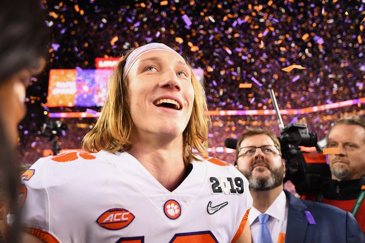Quarterback Trevor Lawrence celebrates after his Clemson Tigers defeated the Alabama Crimson Tide for college football's national championship on Jan. 7. He and his teammates aren't paid for their efforts.