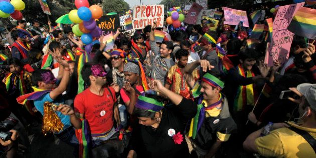 Participants gather for the 5th Delhi Queer Pride parade in New Delhi, India, Sunday, Nov. 25, 2012. Hundreds of gay rights activists marched through New Delhi on Sunday to demand that they be allowed to lead lives of dignity in India's deeply conservative society.(AP Photo/ Mustafa Quraishi)