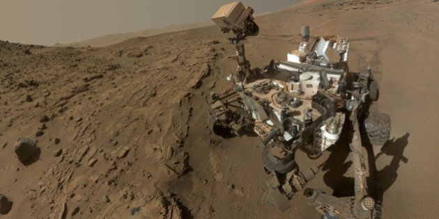 FILE - This file photo released on June 23, 2014 by NASA, shows NASA's Curiosity Mars rover self-portrait. NASA announced Thursday, Sept. 11, 2014, that the rover has reached the base of Mount Sharp, its long-term science destination since landing two years ago. Officials say drilling could begin as early as next week at an outcrop of rocks called Pahrump Hills. (AP Photo/NASA, JPL-Caltech, MSSS, File)