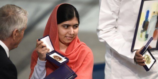Nobel Peace Prize laureate Malala Yousafzai (C) receives her Nobel Prize at the Nobel Peace Prize awarding ceremony at the City Hall in Oslo on December 10, 2014. The 17-year-old Pakistani girls' education activist Malala Yousafzai known as Malala shares the 2014 peace prize with the Indian campaigner Kailash Satyarthi, 60, who has fought for 35 years to free thousands of children from virtual slave labour. AFP PHOTO / ODD ANDERSEN (Photo credit should read ODD ANDERSEN/AFP/Getty Images)