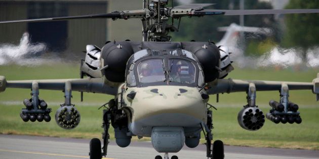 A KA-52 military helicopter, manufactured by Kamov, a unit of OAO Russian Helicopters, taxis after landing on the second day of the Paris Air Show in Paris, France, on Tuesday, June 18, 2013. The 50th International Paris Air Show is the world's largest aviation and space industry show, and takes place at Le Bourget airport June 17-23. Photographer: Chris Ratcliffe/Bloomberg via Getty Images