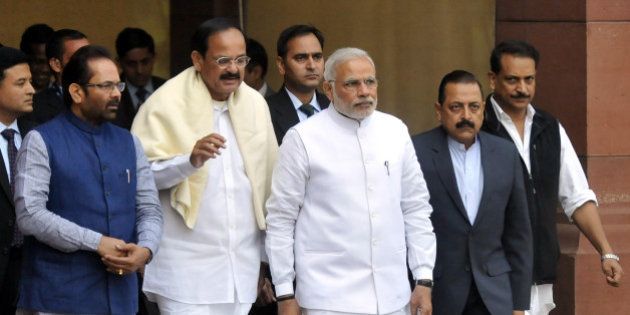 NEW DELHI, INDIA- NOVEMBER 24: Prime Minister Narendra Modi walks with Union Minister of State for Parliamentary Affairs & Minority Affairs Mukhtar Abbas Naqvi, Minister of Urban Development and Parliamentary Affairs Venkaiah Naidu, Minister of State Skill Development & Entrepreneurship (Independent Charge) Rajiv Pratap Rudy, Dr. Jitendra Singh Minister of Science and Technology during the opening day of the winter session of Parliament on November 24, 2014 in New Delhi, India. The Narendra Modi government, which has promised big reforms in its first budget, is looking to push the Insurance Bill as well as the Goods and Service Tax Bill in the month-long winter session that begins today. (Photo by Vipin Kumar/ Hindustan Times via Getty Images)