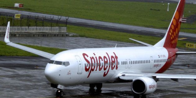 An aircraft from low-cost Indian carrier SpiceJet taxis towards takeoff at the domestic airport in Mumbai on July 15, 2008. US-based fund WL Ross said that it will invest 80 million dollars in struggling Indian low-cost airline SpiceJet. SpiceJet shares surged 4.5 rupees, or 16.1 percent, to an intra-day high of 32.45 rupees (76 US cents) following the announcement, but later retreated to close at 28.5 rupees at the Mumbai stock exchange. The US-based investor is part of global investment manager Invesco, which manages assets for investors in the US, Europe and Asia. Airlines in India, reeling from cut-throat competition in the sector, have also been hard hit by spiralling fuel prices. India has the world's most expensive turbine fuel prices because of local taxes of up to 30 percent. AFP PHOTO/Sajjad HUSSAIN MORE IN IMAGE FORUM (Photo credit should read SAJJAD HUSSAIN/AFP/Getty Images)