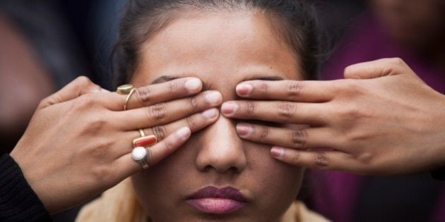 An Indian girl participates in a street play to create awareness on violence against women during a protest ahead of the second anniversary of the deadly gang rape of a 23-year-old physiotherapy student on a bus, in New Delhi, India, Monday, Dec. 15, 2014. The case sparked public outrage and helped make womenâs safety a common topic of conversation in a country where rape is often viewed as a womanâs personal shame to bear. (AP Photo/Tsering Topgyal)