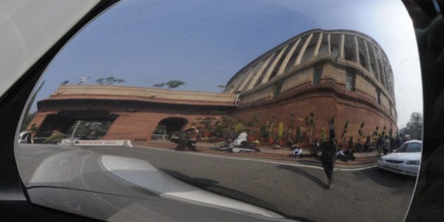 NEW DELHI, INDIA - DECEMBER 16: A View of Parliament house during the Parliament Winter Session on December 16, 2014 in New Delhi, India. Lok Sabha passed a bill to regularise unauthorized colonies and rehabilitate slum dwellers in poll-bound Delhi.( Photo by Sonu Mehta/Hindustan Times via Getty Images)