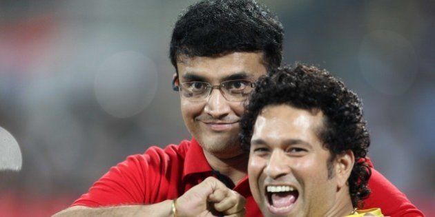 MUMBAI, INDIA - DECEMBER 20: Sachin Tendulkar of Mumbai City FC (Blue) and Sourav Ganguly of Atletico De Kolkata (White) during a closing ceremony of Indian Super League football tournament after final football match between Mumbai City FC (Blue) and Atletico De Kolkata (White) at DY Patil Stadium on December 20, 2014 in Mumbai, India. (Photo by Satish Bate/Hindustan Times via Getty Images)