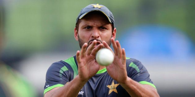 Pakistan's Shahid Afridi prepares to catch the ball during a training session ahead of their ICC Twenty20 Cricket World Cup match against India in Dhaka, Bangladesh, Thursday, March 20, 2014. (AP Photo/Aijaz Rahi)