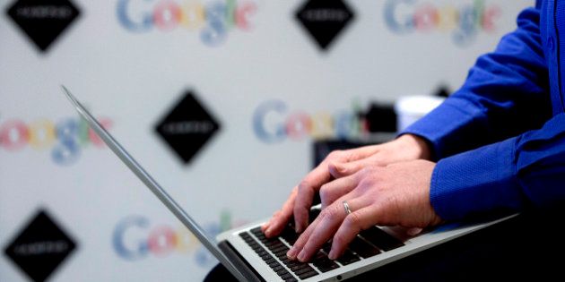 A visitor uses a laptop computer at Google Inc.'s London Campus, in London, U.K., on Monday, Dec. 2, 2013. Both Amazon Inc. and Google Inc. are building large new facilities in the city, with the search giant pledging to employ 5,000 staff in a new office next to the renovated King's Cross railway hub. Photographer: Jason Alden/Bloomberg via Getty Images