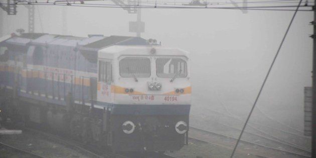 ALLAHABAD, INDIA - 2014/12/22: A train running slow during a cold and foggy morning. Train time departure and arrival are not followed due to the foggy situation in railways. (Photo by Amar Deep/Pacific Press/LightRocket via Getty Images)